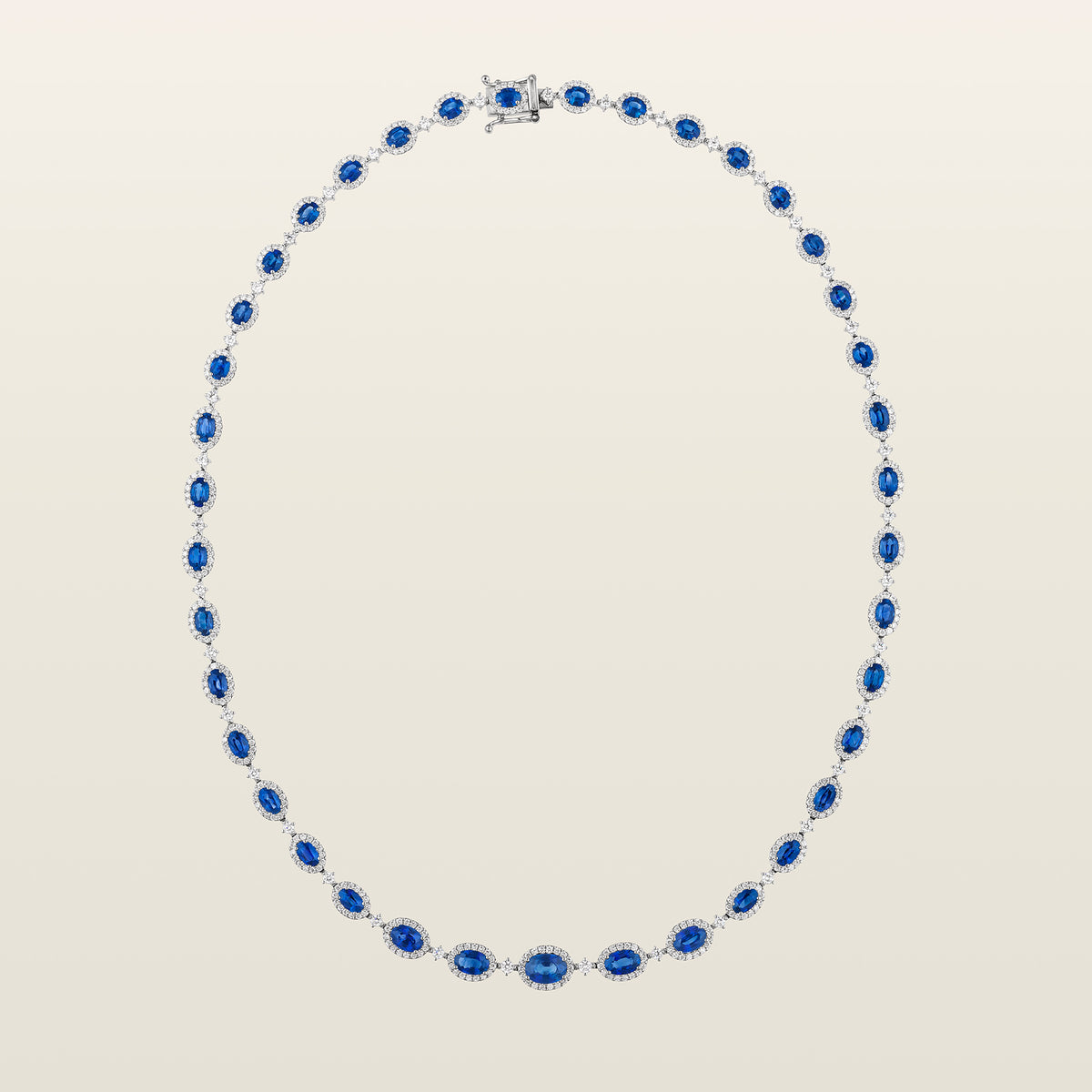 Collier Rivière saphirs et diamants posé en ovale, saphirs ovales entourés de diamants, fermoir en haut