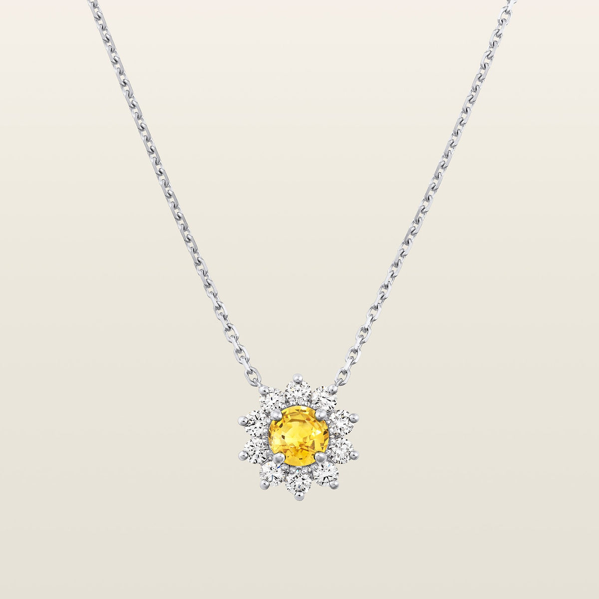 packshot fond beige du pendentif-heritage-saphir-jaune